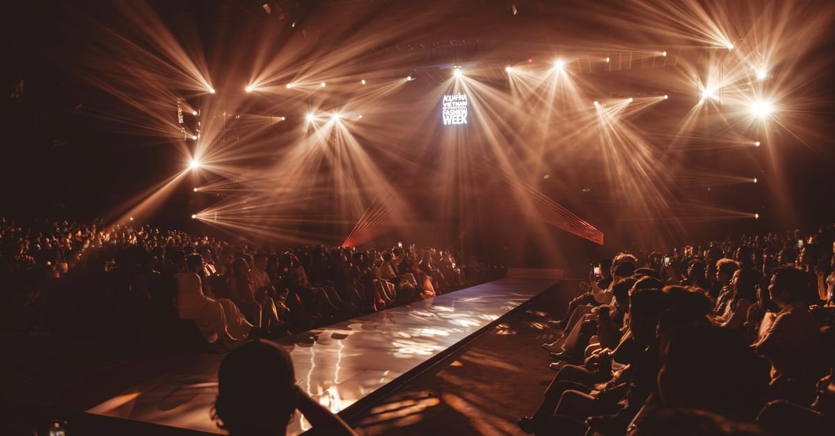Exciting fashion show event with dazzling lights and a captivated audience.