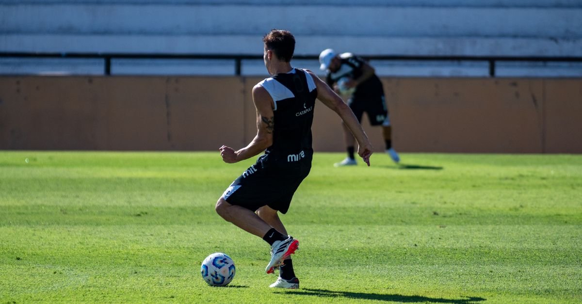 A soccer player training on a sunny day, showcasing agility and skill.