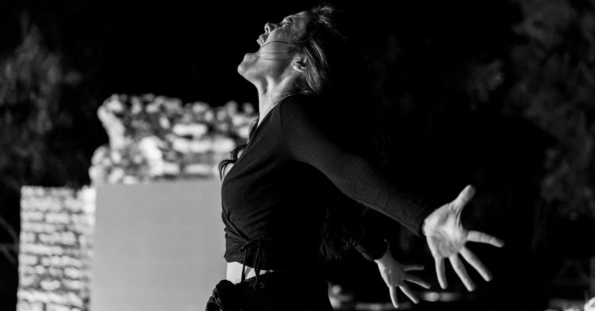 Intense performance captured in black and white at Butrint, Albania.