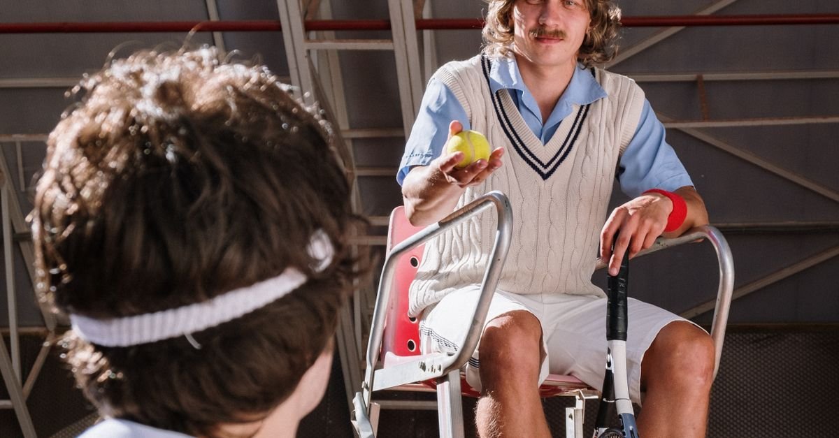 Retro tennis scene with umpire and player, indoor court setting showcasing classic style and sportsmanship.