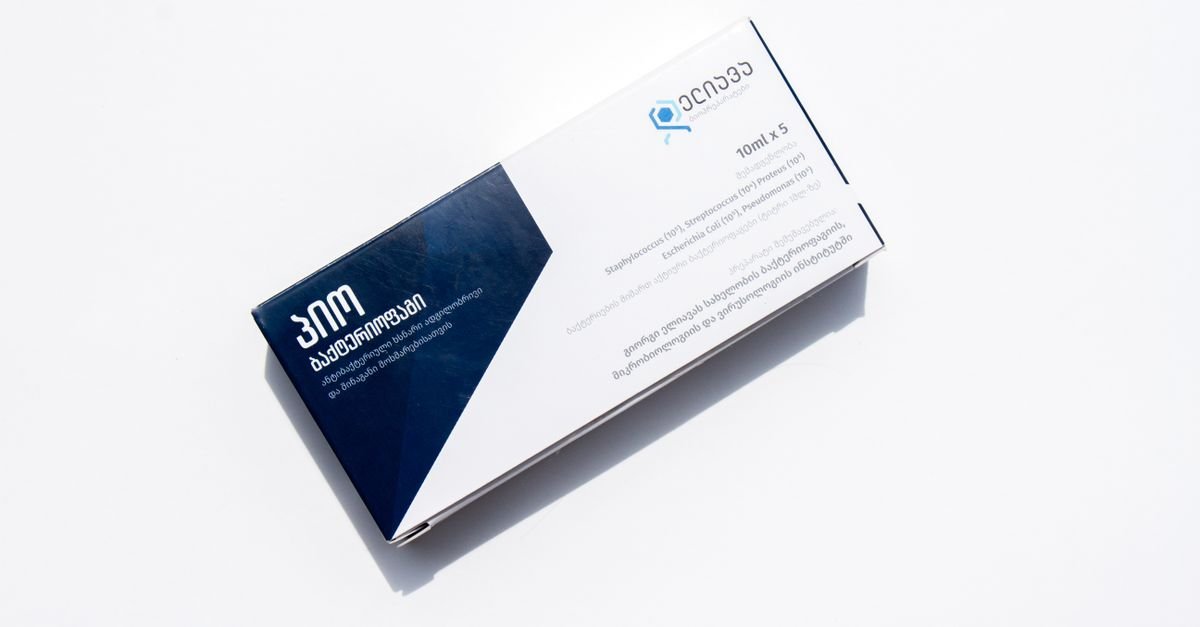 A medicine box with English and Georgian text, isolated on a white background for healthcare purposes.